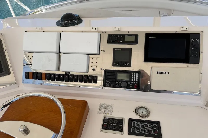 Slide: The Image of Control panel of a 1995 Bertram 60 Convertible yacht with navigation instruments. - 37