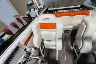 Slide: The Image of 2021 Velocity 290 Sport Cruiser interior with white and orange seating. - 15