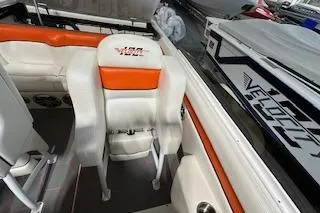 Slide: The Image of 2021 Velocity 290 Sport Cruiser interior with orange and white seating. - 16