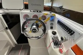 Slide: The Image of 2021 Velocity 290 Sport Cruiser dashboard with Garmin navigation and modern controls. - 17