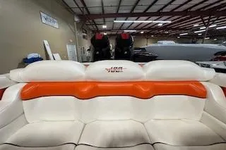Slide: The Image of 2021 Velocity 290 Sport Cruiser interior with white and orange seating in a showroom. - 20