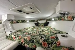 Slide: The Image of 2021 Velocity 290 Sport Cruiser cabin with floral bedding and modern interior design. - 24