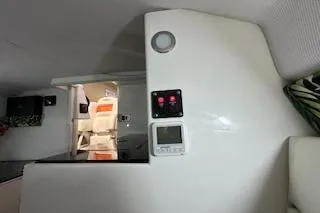 Slide: The Image of Interior of 2021 Velocity 290 Sport Cruiser with modern controls and seating area. - 26