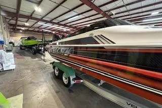 Slide: The Image of 2021 Velocity 290 Sport Cruiser in a warehouse, showcasing sleek design and vibrant colors. - 3