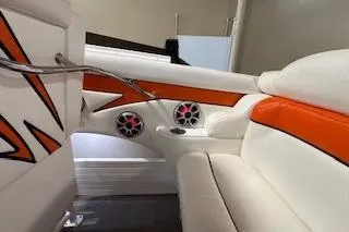 Slide: The Image of Interior of 2021 Velocity 290 Sport Cruiser with orange and white seating. - 34