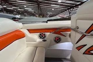 Slide: The Image of 2021 Velocity 290 Sport Cruiser interior with orange and white seating, speakers, and sleek design. - 35
