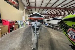 Slide: The Image of 2021 Velocity 290 Sport Cruiser in a warehouse, front view on trailer. - 9