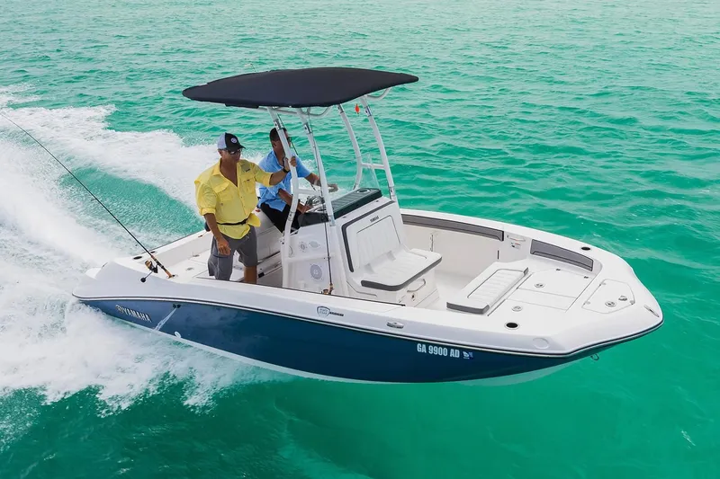 Slide: The Image of 2018 Yamaha 190 FSH Sport boat on turquoise water. - 5