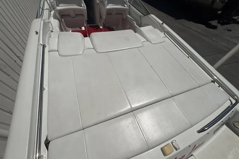 Slide: The Image of 2001 Formula 353 FASTech boat with white cushioned seating and sleek design. - 11