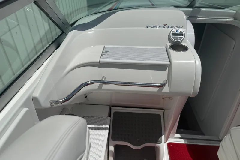 Slide: The Image of 2001 Formula 353 FASTech boat interior with sleek white dashboard and chrome accents. - 14