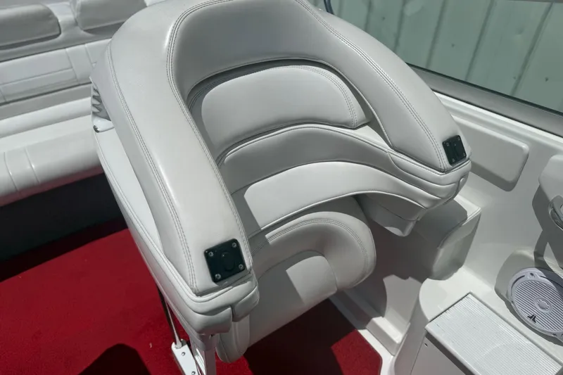 Slide: The Image of White leather seat in 2001 Formula 353 FASTech boat, red carpet, sleek interior design. - 17
