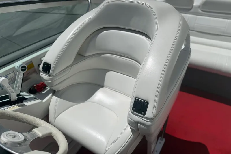 Slide: The Image of 2001 Formula 353 FASTech boat interior with white leather seating and red carpet. - 19