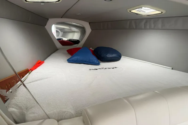 Slide: The Image of Interior cabin of a 2001 Formula 353 FASTech boat with cushions and bedding. - 24