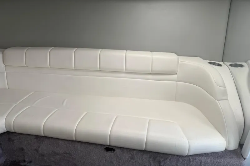 Slide: The Image of 2001 Formula 353 FASTech boat interior with white leather seating and cup holders. - 26