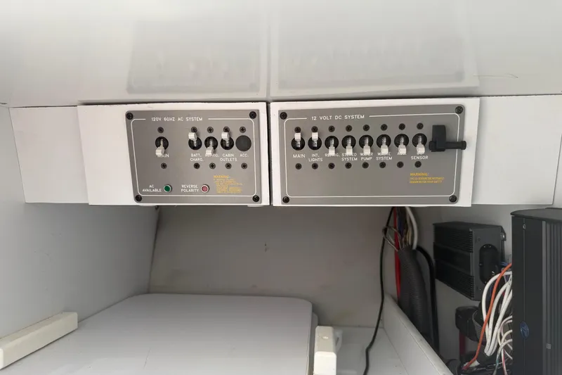 Slide: The Image of Control panel of a 2001 Formula 353 FASTech boat, featuring AC and DC systems. - 30