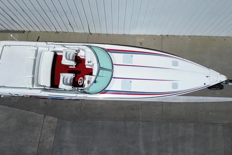 Slide: The Image of Overhead view of a 2001 Formula 353 FASTech speedboat with red interior and sleek design. - 34