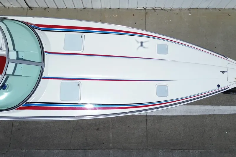 Slide: The Image of Overhead view of 2001 Formula 353 FASTech boat with sleek design and colorful stripes. - 36