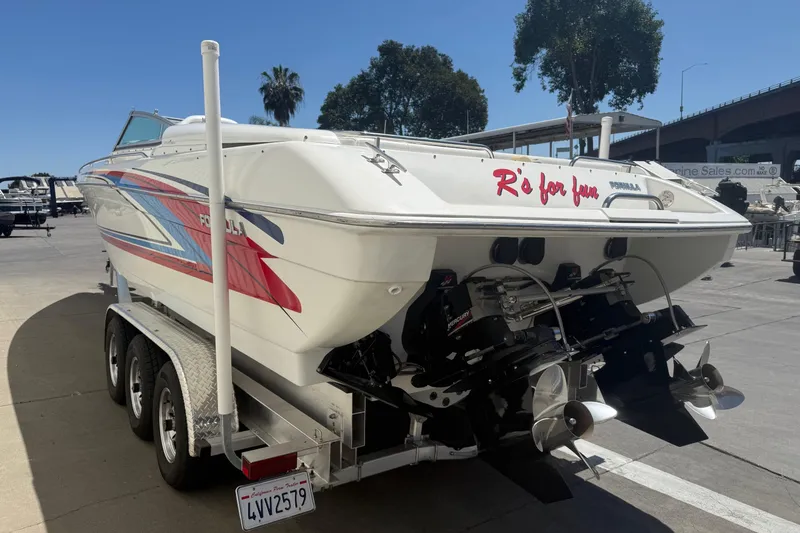 Slide: The Image of 2001 Formula 353 FASTech boat on trailer, rear view with colorful graphics. - 4