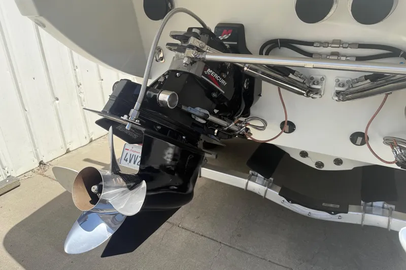 Slide: The Image of 2001 Formula 353 FASTech boat engine with Mercury outdrive, showcasing propeller and hydraulic components. - 7