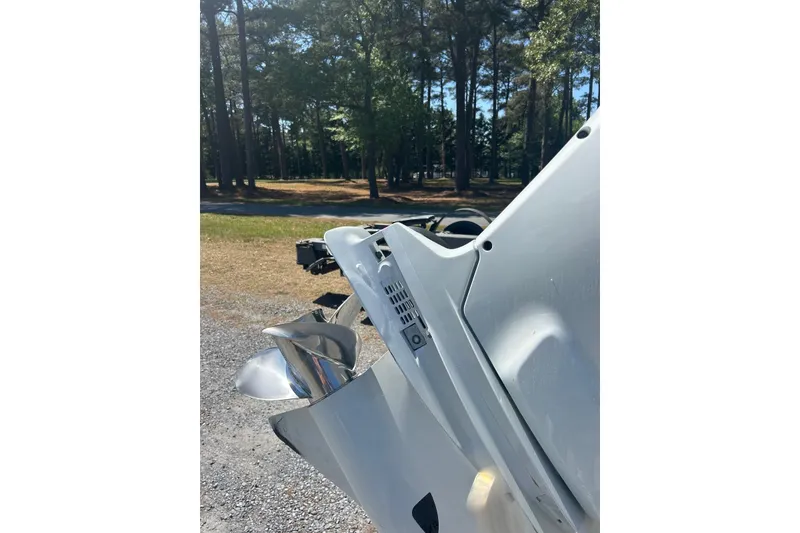 Slide: The Image of 2023 Rambo 27 Center Console boat propeller in a wooded outdoor setting. - 14