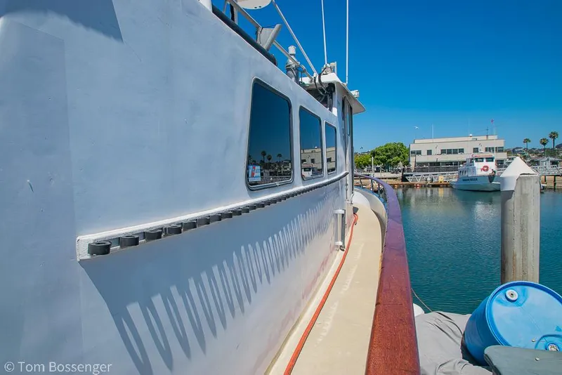 Slide: The Image of 1975 Blanchard Passenger Sportfisher docked at marina under clear blue sky. - 13