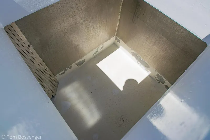 Slide: The Image of Empty storage compartment on 1975 Blanchard Passenger Sportfisher boat, showing clean interior. - 30