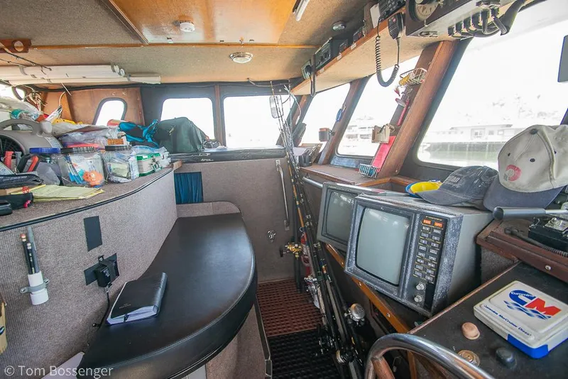 Slide: The Image of Interior of a 1975 Blanchard Passenger Sportfisher with fishing gear and navigation equipment. - 6
