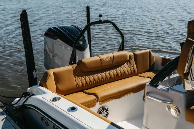 Slide: The Image of 2026 Key West 239 FSR boat with tan leather seating and Yamaha engine on water. - 10