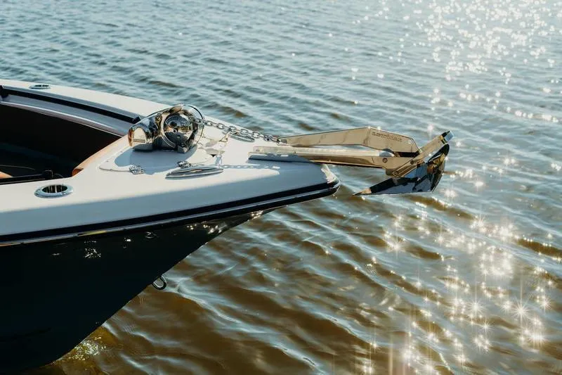 Slide: The Image of 2026 Key West 239 FSR boat bow with anchor, sparkling water background. - 12