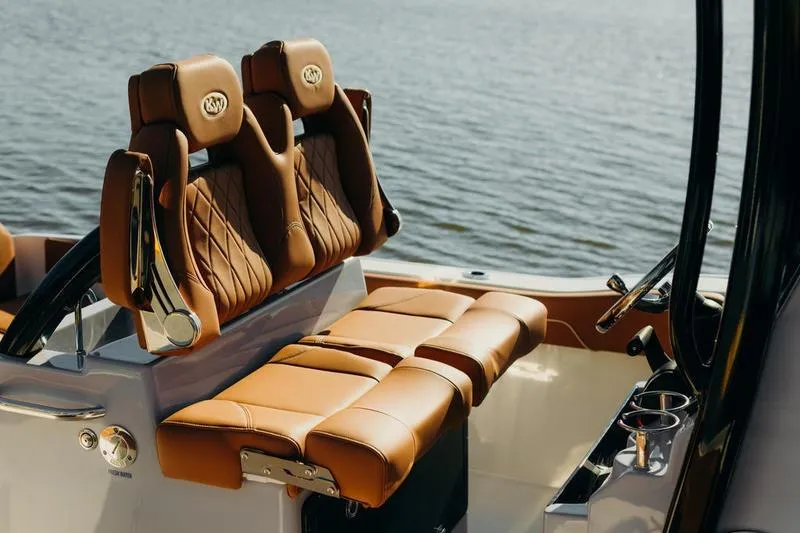 Slide: The Image of Luxurious seating on 2026 Key West 239 FSR boat, overlooking calm waters. - 14