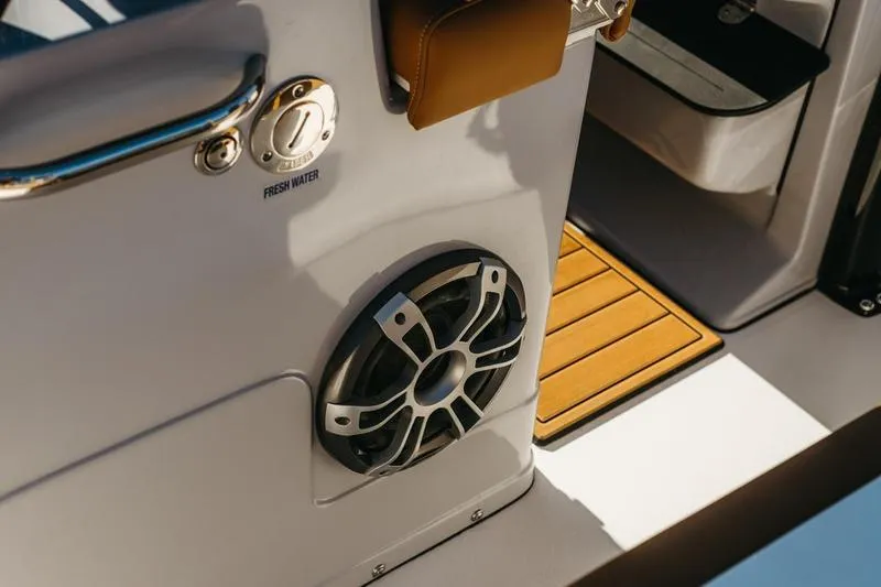 Slide: The Image of 2026 Key West 239 FSR boat interior with speaker and fresh water access. - 3