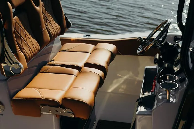 Slide: The Image of Luxurious interior of 2026 Key West 239 FSR boat with brown leather seating. - 39