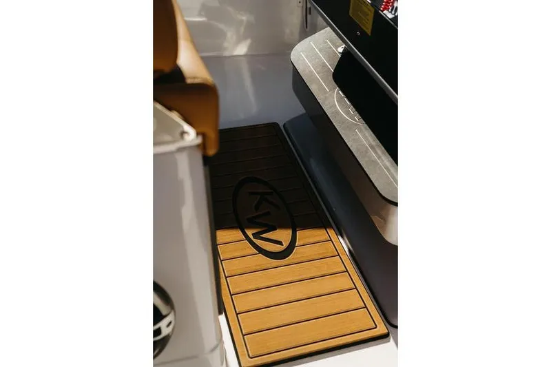 Slide: The Image of 2026 Key West 239 FSR boat interior with KW-branded floor mat. - 45