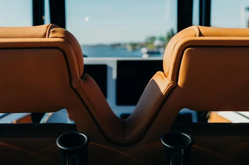Slide: The Image of Interior view of 2026 Key West 239 FSR boat with tan leather seats. - 48