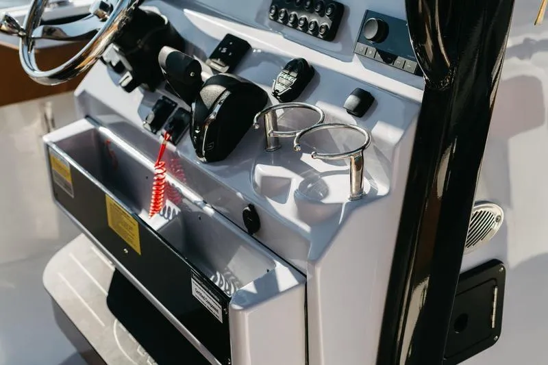 Slide: The Image of Helm of 2026 Key West 239 FSR boat with steering wheel and controls. - 49