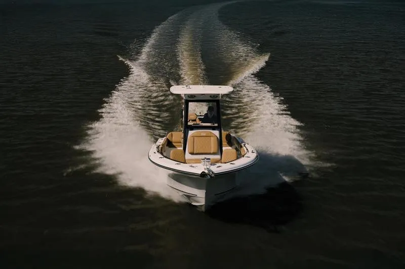 Slide: The Image of 2026 Key West 239 FSR boat cruising on open water, creating a wake. - 5