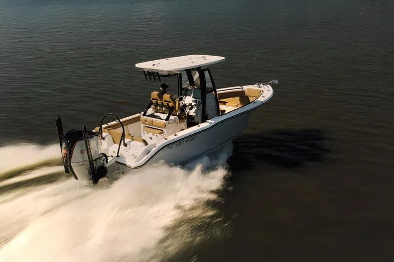 Slide: The Image of 2026 Key West 239 FSR boat cruising on open water, showcasing sleek design and performance. - 7