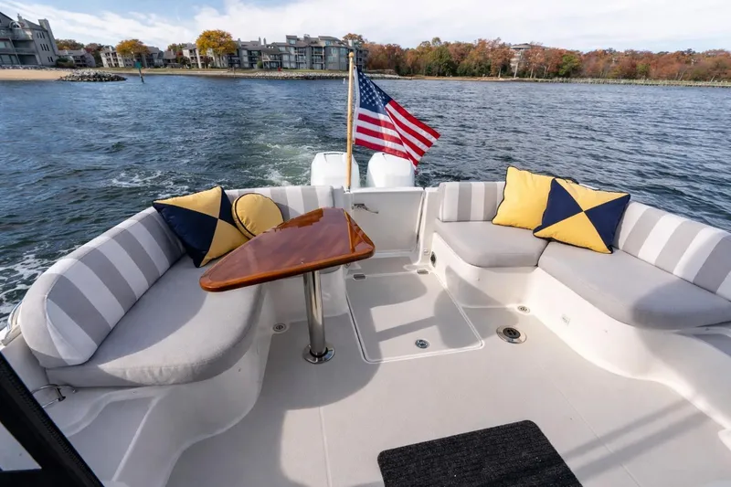 Slide: The Image of Comfortable cockpit for a crowd. Center transom door for easy boarding. - 4