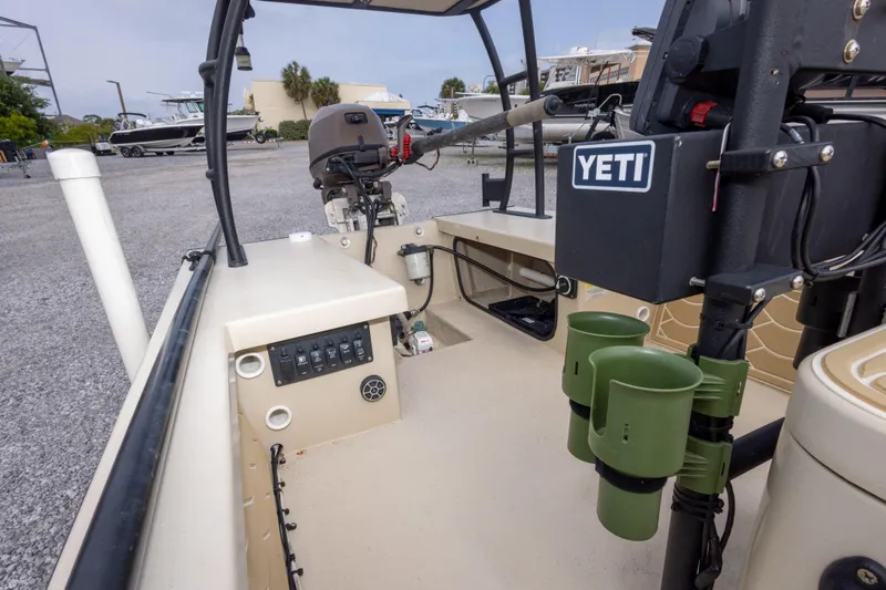 Slide: The Image of Interior view of a 2016 Salt Marsh 1444 boat with Yeti cooler and motor. - 13