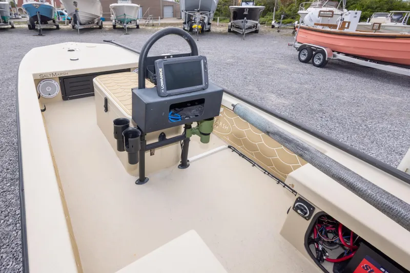 Slide: The Image of Interior of a 2016 Salt Marsh 1444 boat with navigation equipment and storage. - 14