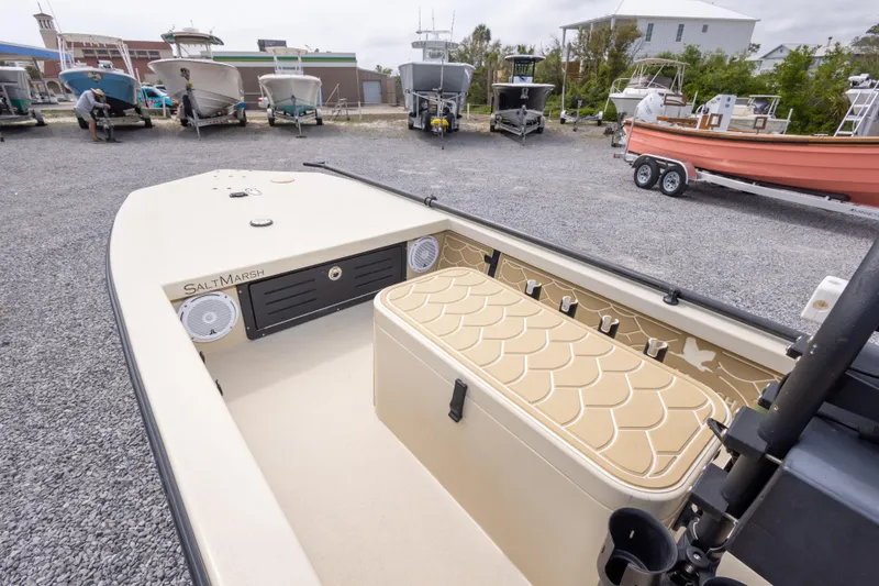 Slide: The Image of Salt Marsh 1444 boat, 2016 model, parked in a marina with other boats. - 18