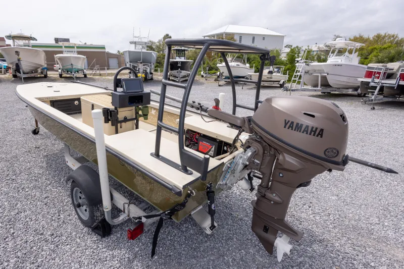 Slide: The Image of 2016 Salt Marsh 1444 boat with Yamaha motor on gravel lot. - 4