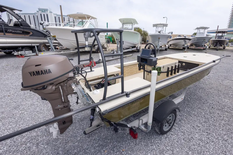 Slide: The Image of 2016 Salt Marsh 1444 boat with Yamaha motor on trailer, surrounded by other boats. - 9
