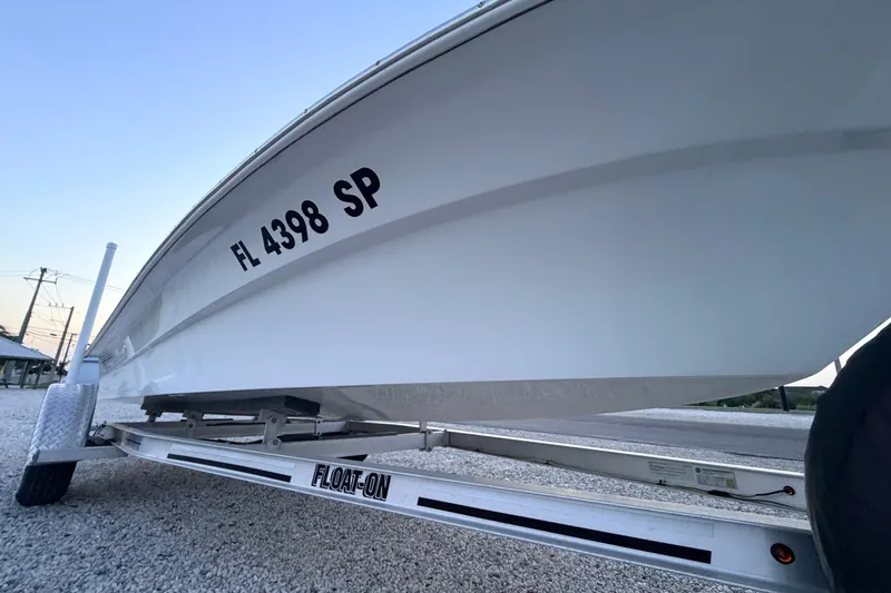 Slide: The Image of 2019 Mitzi Skiffs 17 boat on trailer, side view with registration number FL 4398 SP. - 14