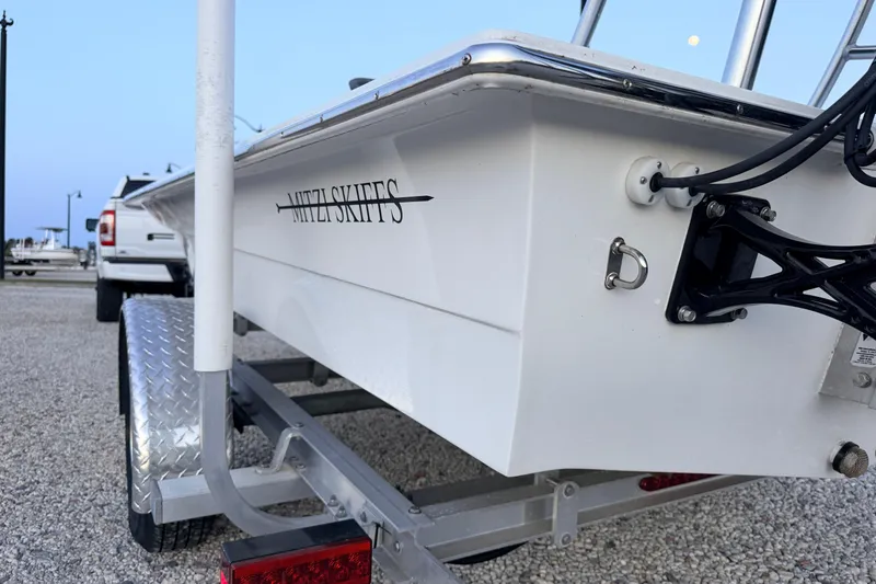 Slide: The Image of 2019 Mitzi Skiffs 17 boat on trailer, parked outdoors. - 23