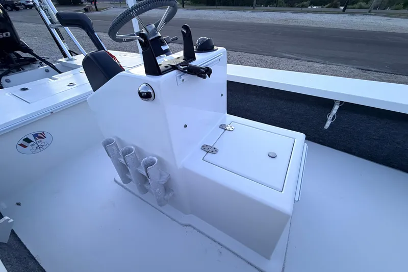 Slide: The Image of Center console of a 2019 Mitzi Skiffs 17 boat with steering wheel and rod holders. - 35