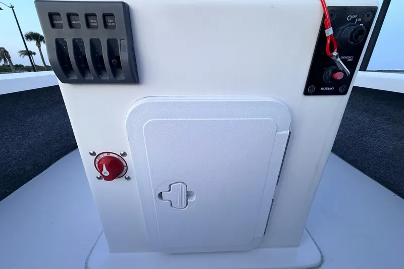 Slide: The Image of Control panel of a 2019 Mitzi Skiffs 17 boat with switches and emergency stop. - 41