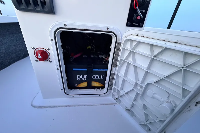 Slide: The Image of Open battery compartment on 2019 Mitzi Skiffs 17, featuring a Duracell Ultra battery. - 43