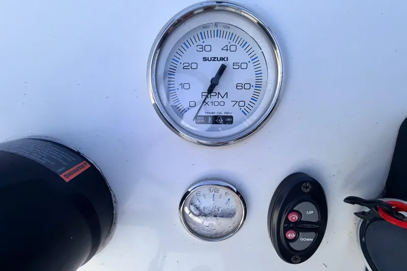 Slide: The Image of Close-up of a 2019 Mitzi Skiffs 17 boat dashboard with Suzuki RPM gauge. - 45