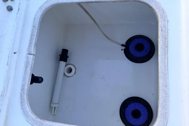 Slide: The Image of Livewell interior of a 2019 Mitzi Skiffs 17 boat, featuring drainage and aeration components. - 47